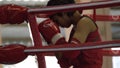 The woman boxer in the ring of thai boxing indoor have to practice first isÃ¢â¬ÅWaiKruÃ¢â¬Â.